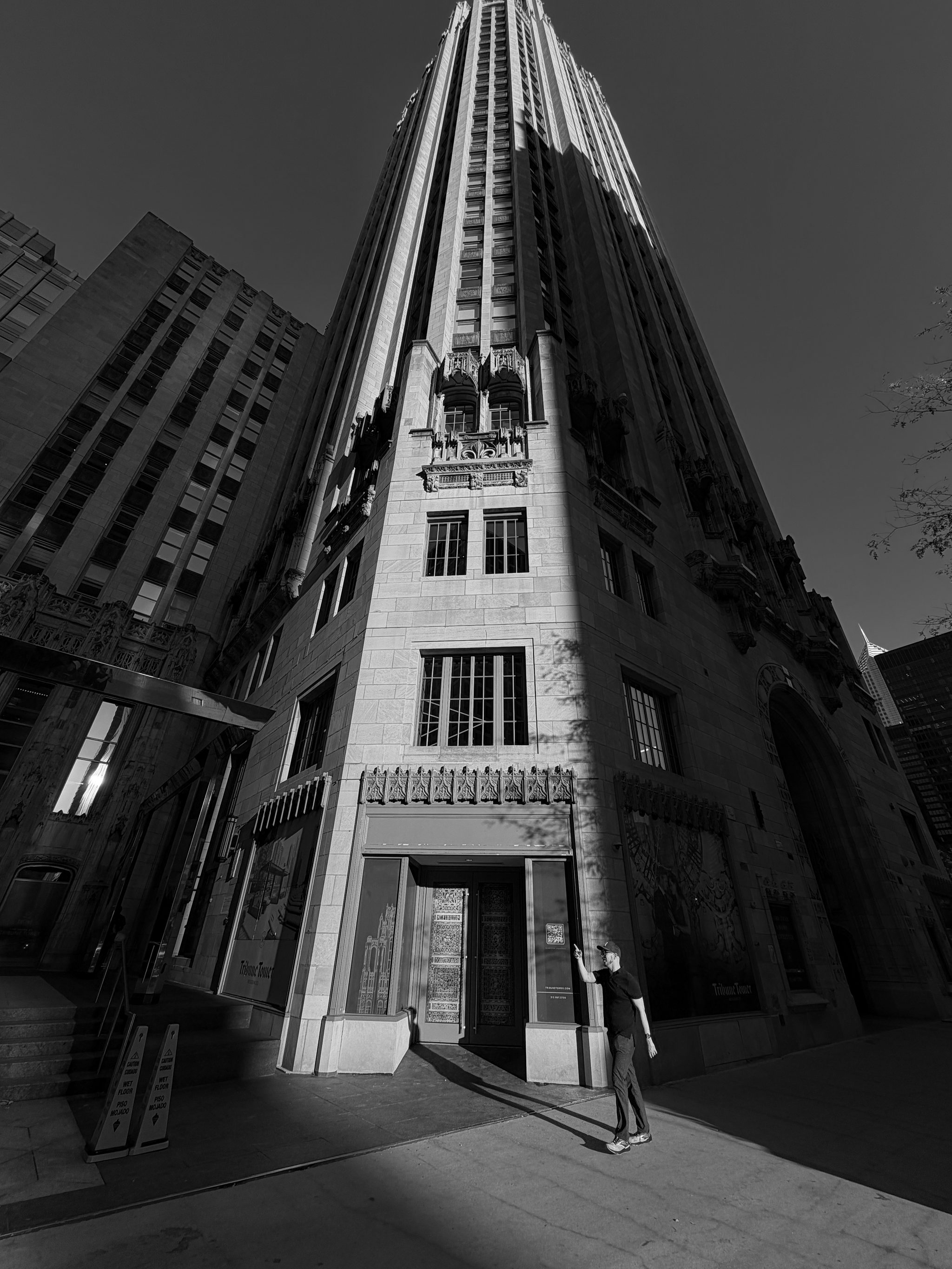 Looking up the ornate Gothic Tribune Tower from street level.